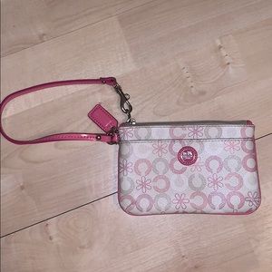 Pink and white coach wristlet